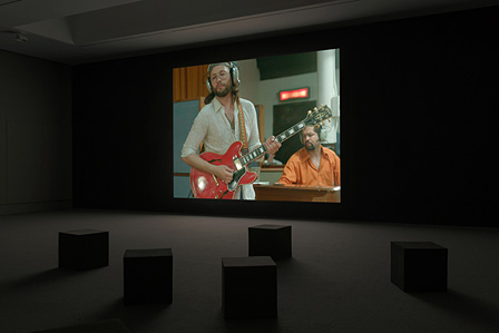 Installation view of Stan Douglas, Luanda-Kinshasa, 2013. Single-channel video projection, 6 hr. 1 min. (loop), color, sound
